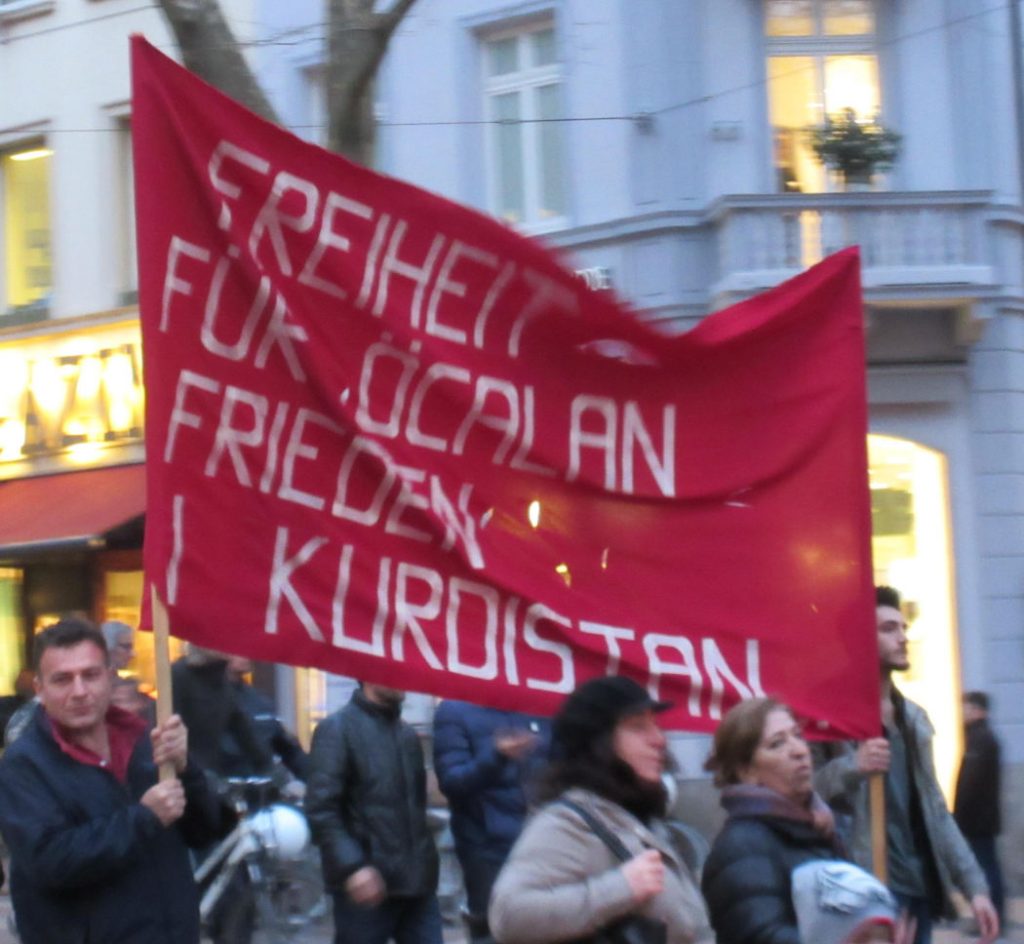 Kurdish protest in Freiburg, Germany. The poster reads 'Freedom for Öcalan, peace in Kurdistan'. It refers to Abdullah Öcalan, who is a Kurdish nationalist leader and one of the founders of the PKK. Photo by: Joshua Stein.