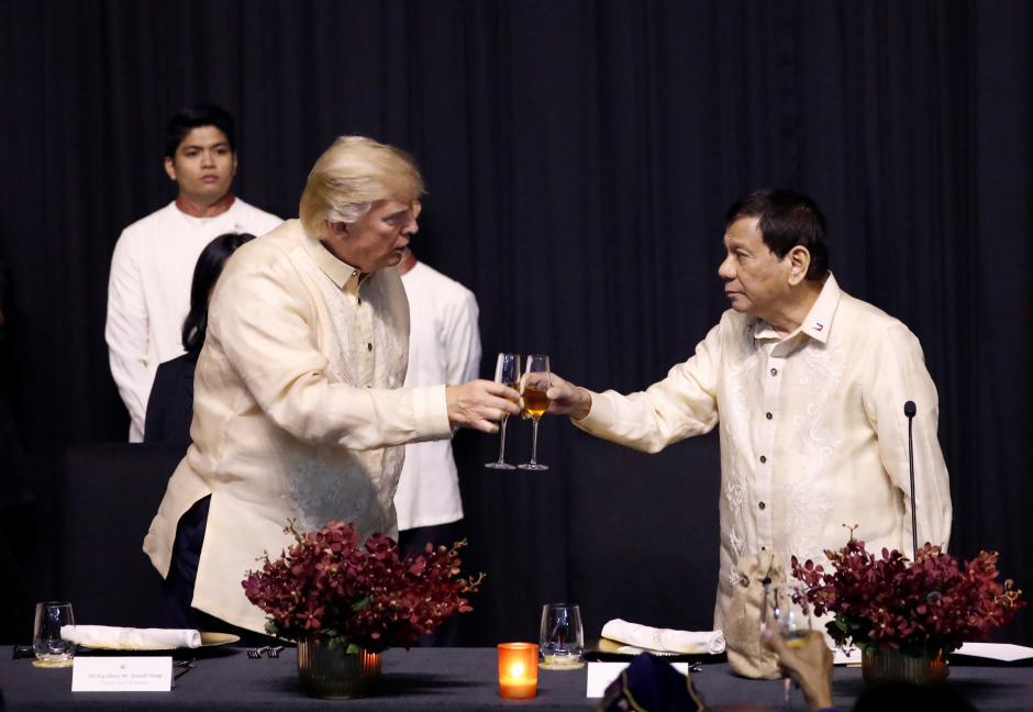 U.S. President Donald Trump toasts with Philippines President Rodrigo Duterte during the gala dinner marking ASEAN's 50th anniversary in Manila, Philippines November 12, 2017. REUTERS/Jonathan Ernst