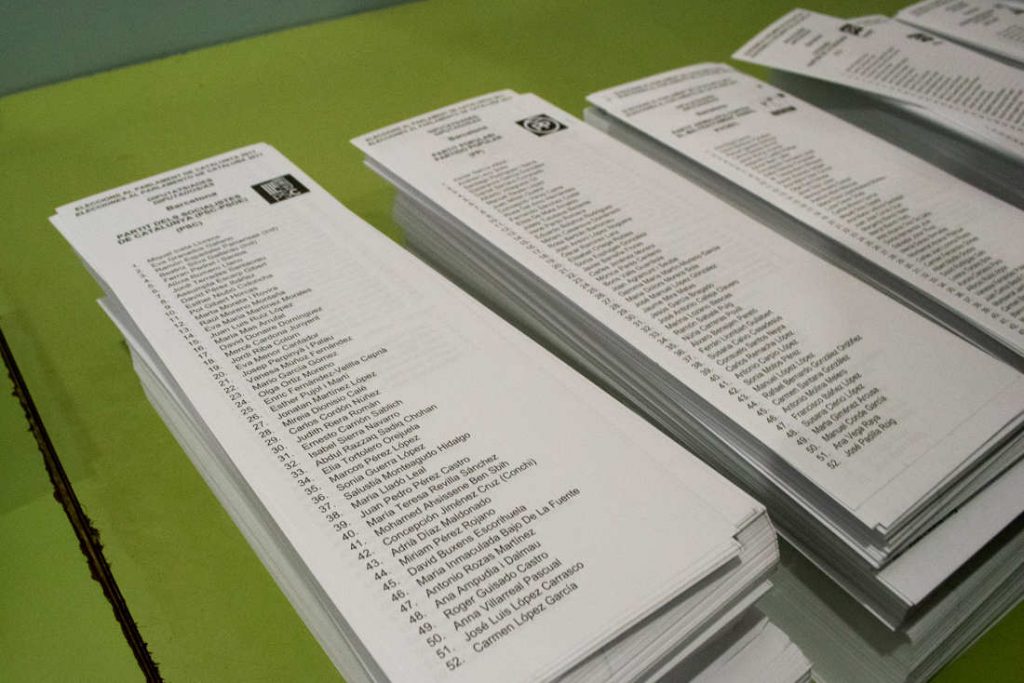 Voters pick one leaflet to vote for their party. Photo by: Evan McCaffrey.