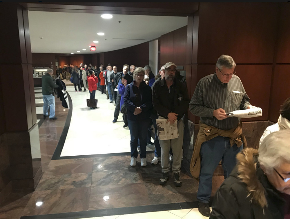 Hundreds of people in line at the Fairfax Govt Center. Photo by: Neal Augenstein.