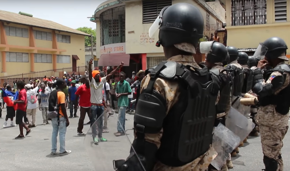 Haiti unrest: Protesters pillaged stores, torched cars.